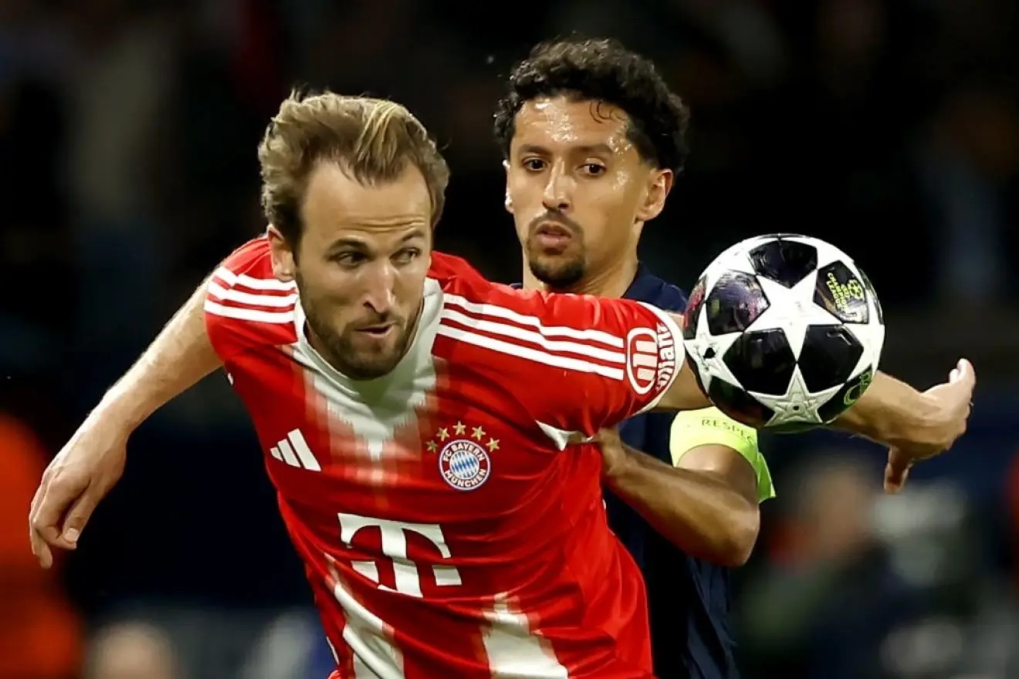 Harry Kane lucha por un balón con Marquinhos
