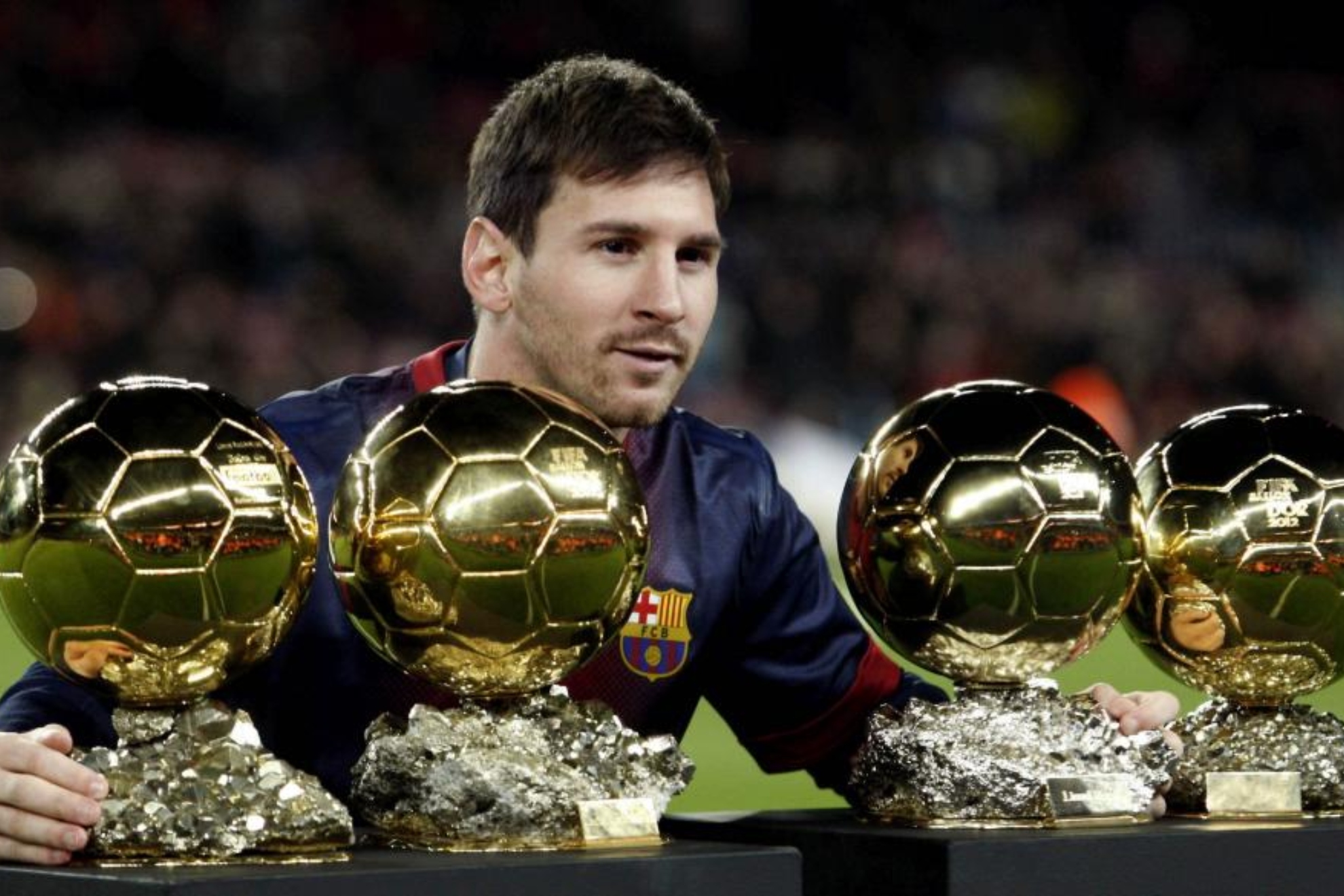Messi junto a los Balones de Oro.
